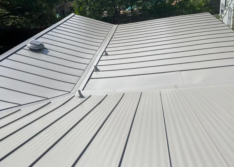 Solar attic fan installed on a metal roof for Roof Ventilation in Milwaukie